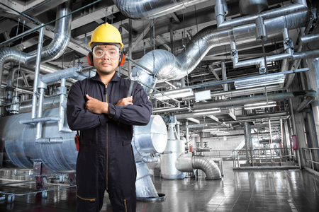 Electrical engineer working at control room of modern thermal power plant industrialの写真素材