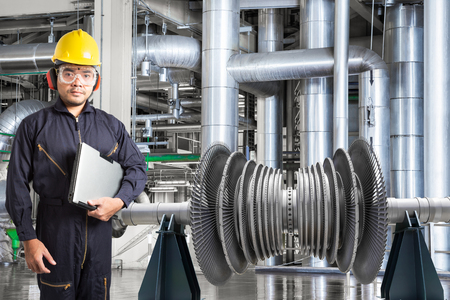 Technician with laptop computer for maintenance equipment rotor of a steam turbine at thermal power plant industryの写真素材