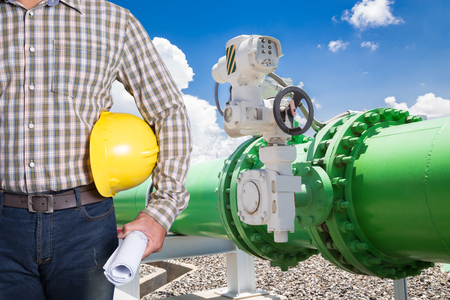 Maintenance technician with pipeline valves of cooling water system in power plantの写真素材