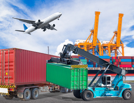 Truck transport container with crane lifting and cago plane flying above ship port with working crane loading bridge in shipyard for logistic import export conceptの写真素材