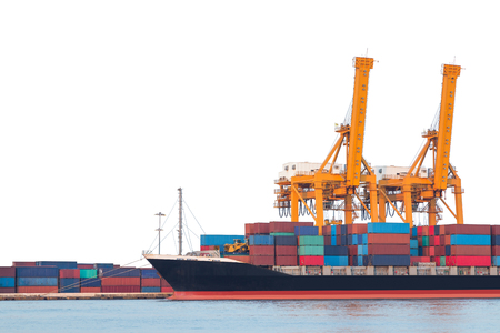 Cargo ship with crane in the harbor isolated on white background with clipping pathの写真素材