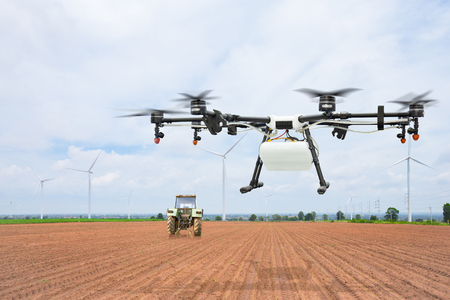 Agriculture drone flying on preparing landの写真素材