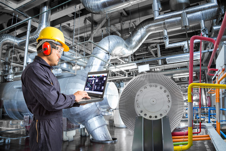 Engineer using laptop computer for maintenance in thermal power plant industrailの写真素材