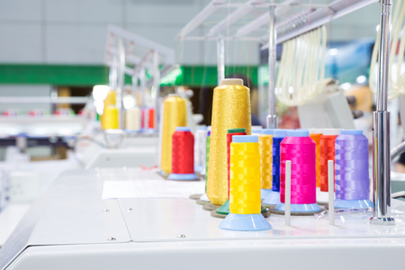 Thread spools in garment factoryの写真素材