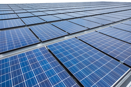 Solar panels on factory roofの写真素材