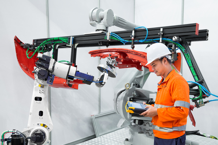 Engineer using measurement tool inspect industrial robot grip automotive workpiece, Smart factory conceptの写真素材