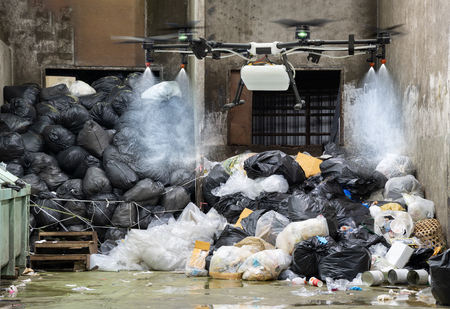 Drone is flying to spray the disinfectants in garbage shedの写真素材