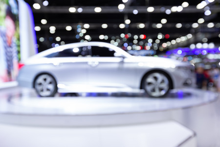 Blurred image of car exhibition show, innovative automotive exhibitions conceptの写真素材