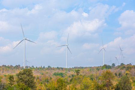 Wind turbine with autumn color leavesの写真素材