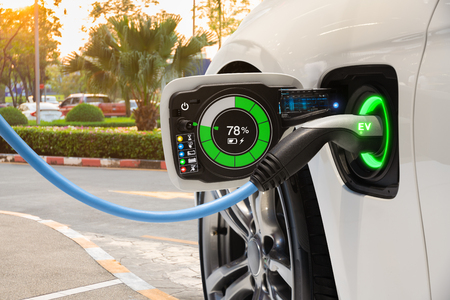 Electric vehicle changing on street parking with graphical user interface, Future EV car conceptの写真素材