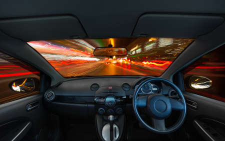 Autonomous car with motion speed light at night traffic sceneの写真素材