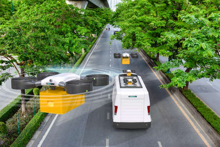 Autonomous delivery drone landing to electric van after deliver parcel on green road, Future transportation and logistic conceptの写真素材