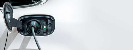 White electric car charging with copy space, Technology electric vehicle conceptの写真素材