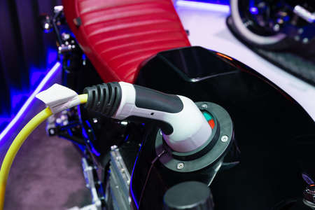 Electric motorcycle charging, Future technology EV conceptの写真素材