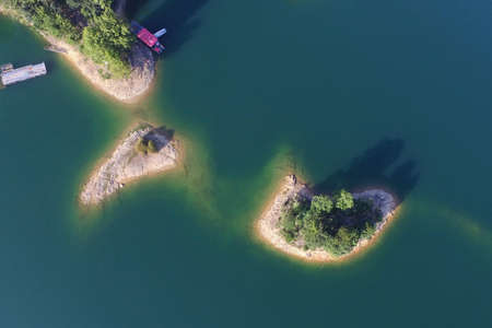Aerial shots in Qiandao Lake, Hangzhou, China. Overhead shots of islands, mountains and boats in the...