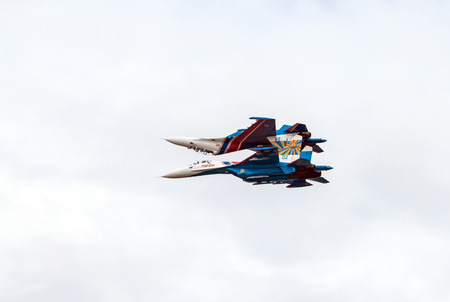 Two heavy fighters Sukhoi Su-27, NATO reporting name: Flanker perform the maneuver called The mirror...
