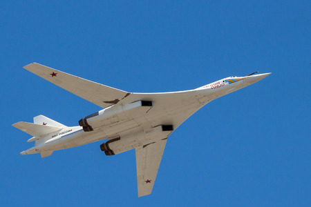 Strategic supersonic bomberTu-160  in flight, Victory Day parade, Moscow, Russia, May, 9 2016. Blue...