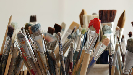 An artist is showing some techniques of painting