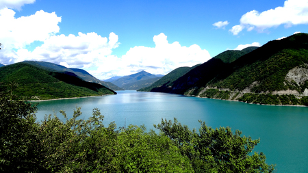 A beautiful view of the lake, nice color, surrounded by mountains in the background of a beautiful sky. Backgroundの写真素材