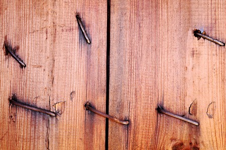 An old cracked board with nails. Wooden texture.の写真素材