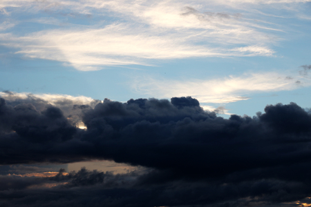 A view of the dark clouds during sunset. Backgroundの写真素材