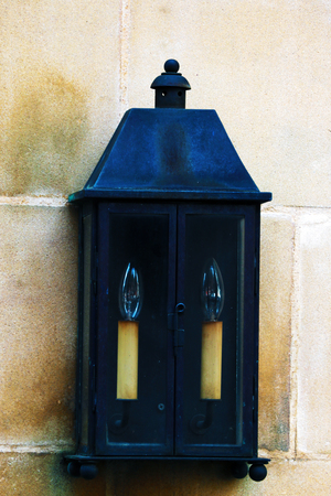 On the street hanging candles in an iron case with glass.の写真素材