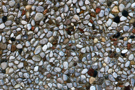 Many small multi-colored stones of different shapes, textureの写真素材