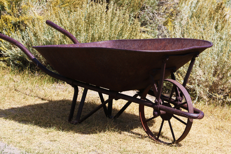 Old rusty car standing in a grass field.の写真素材