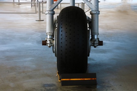 The front landing gear of a small aircraft on the groundの写真素材