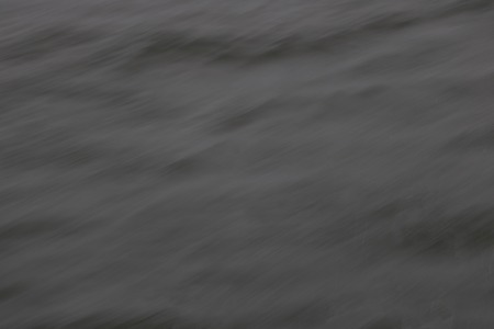 Blur abstract background dark gray color toneの写真素材