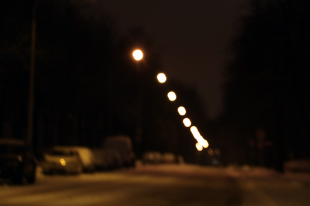 Parked cars covered in snow - a blizzard with a blurred backgroundの写真素材