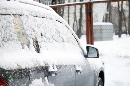 frozen car window closeup snow ice crystals cold weatherの写真素材