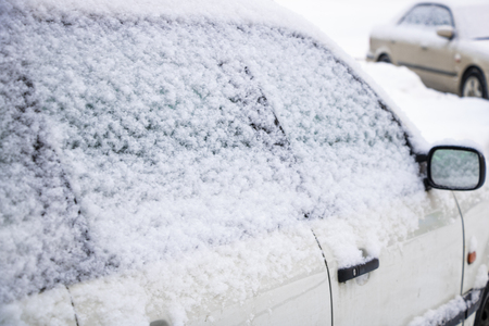 Winter city, drifts on the roads, cars in the snow and snow driftsの写真素材