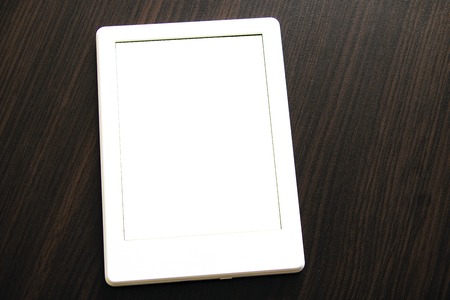 Minsk, Belarus - January 10, 2019: An Amazon Kindle lying on a tabletop. Amazon Kindle devices enable users to browse, buy, download, read e-books, newspapers and other digital mediaのeditorial素材