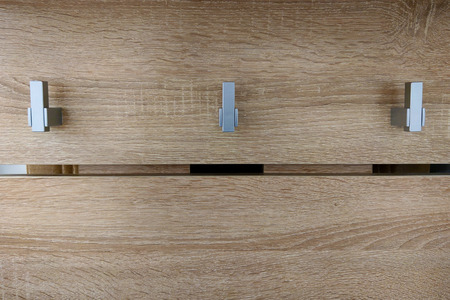 Hooks on a hanger for clothes in the hallway of the houseの写真素材
