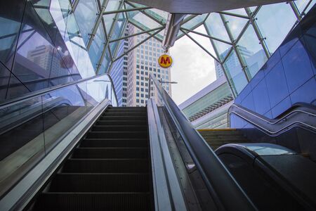 Warsaw, Poland, March 10, 2019: Modern walkway of escalator move forward and escalator move backward