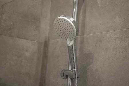 Detail of a corner shower cabin with wall mount shower attachmentの写真素材