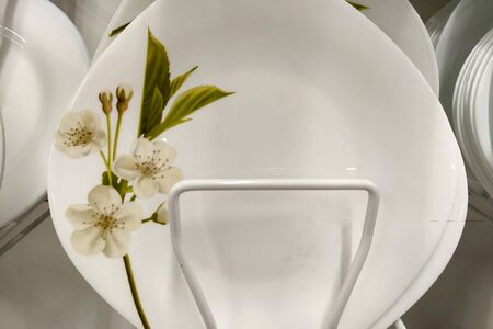 View of a beautiful white plate standing in a shop windowの写真素材