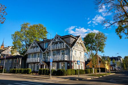 Druskininkai, Lithuania - May 10, 2019: Beautiful wooden house on a sunny dayのeditorial素材