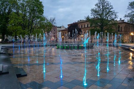 Lublin, Poland - May 14, 2019: Large pedestrian area with beautiful fountains in the eveningのeditorial素材