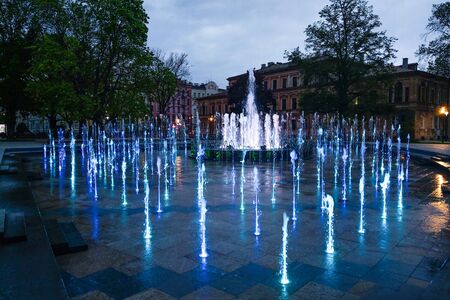 Lublin, Poland - May 14, 2019: Large pedestrian area with beautiful fountains in the eveningのeditorial素材