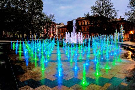 Lublin, Poland - May 14, 2019: Large pedestrian area with beautiful fountains in the eveningのeditorial素材
