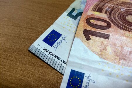 View of the euro bills that lie on the tableの写真素材