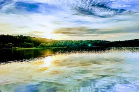 Beautiful sunset on the lake or river. Nature backgroundの写真素材