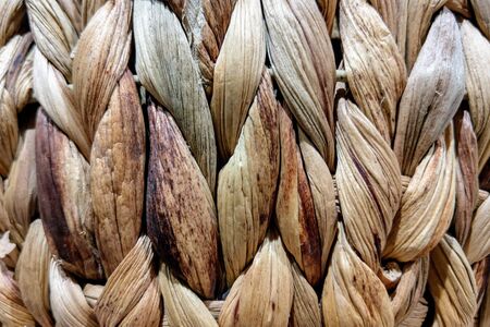 Wicker coasters for food in the kitchen on the table, background