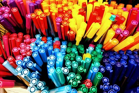 Krakow, Poland, May 22, 2019: Color pencils on the shelf in the store, office supplies. Colorful pens arranged on shelves selling stationeryのeditorial素材