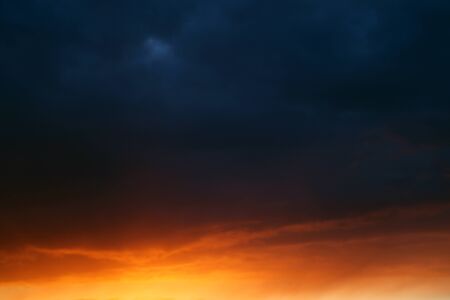 Dramatic field during sunset before a thunderstorm, nature backgroundの写真素材