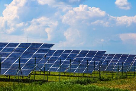 Solar panels with the sunny sky. Blue solar panels, background of photovoltaic modules for renewable...