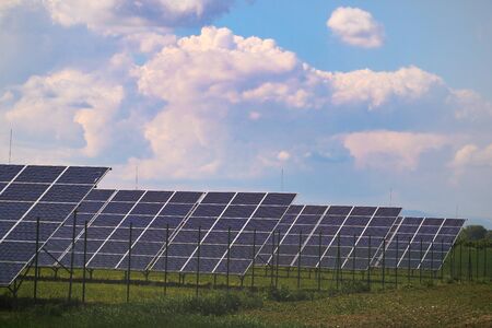 Solar panels with the sunny sky. Blue solar panels, background of photovoltaic modules for renewable energyの写真素材
