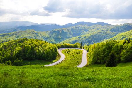 Mountain winding road in Slovakia, view from above with a view of the mountainsの写真素材